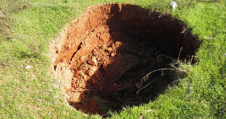 What to Do If You Discover a Sinkhole in Your Lawn